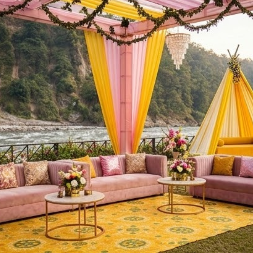Riverside mehendi setup with yellow and pink drapes &mdash; SnazzyTrips Rishikesh