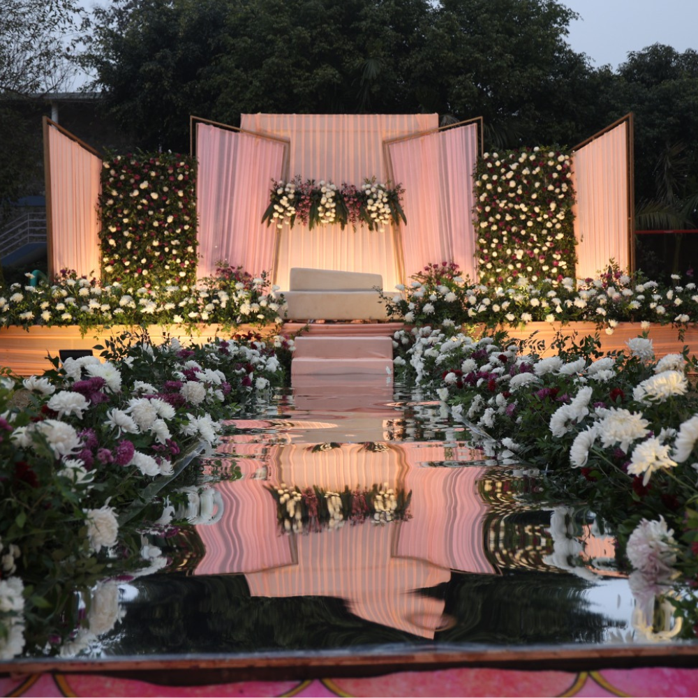Floral mandap wedding setup with mirror aisle &mdash; SnazzyTrips Uttarakhand